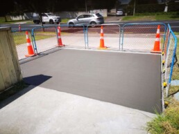 12m2 Driveway repair with road cones and cars on the road