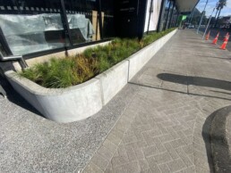 pavers outside a retail precent, and a concrete garden