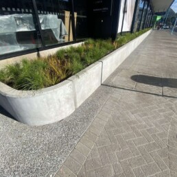 pavers outside a retail precent, and a concrete garden